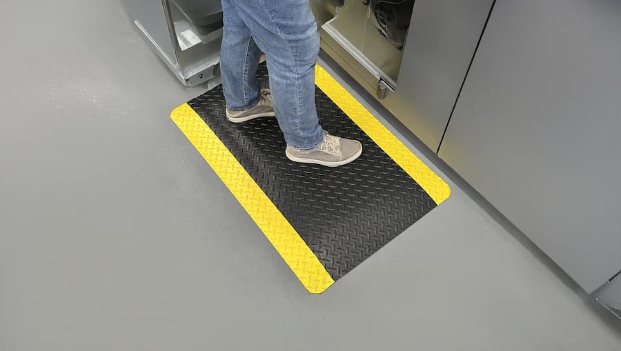 person standing on mat